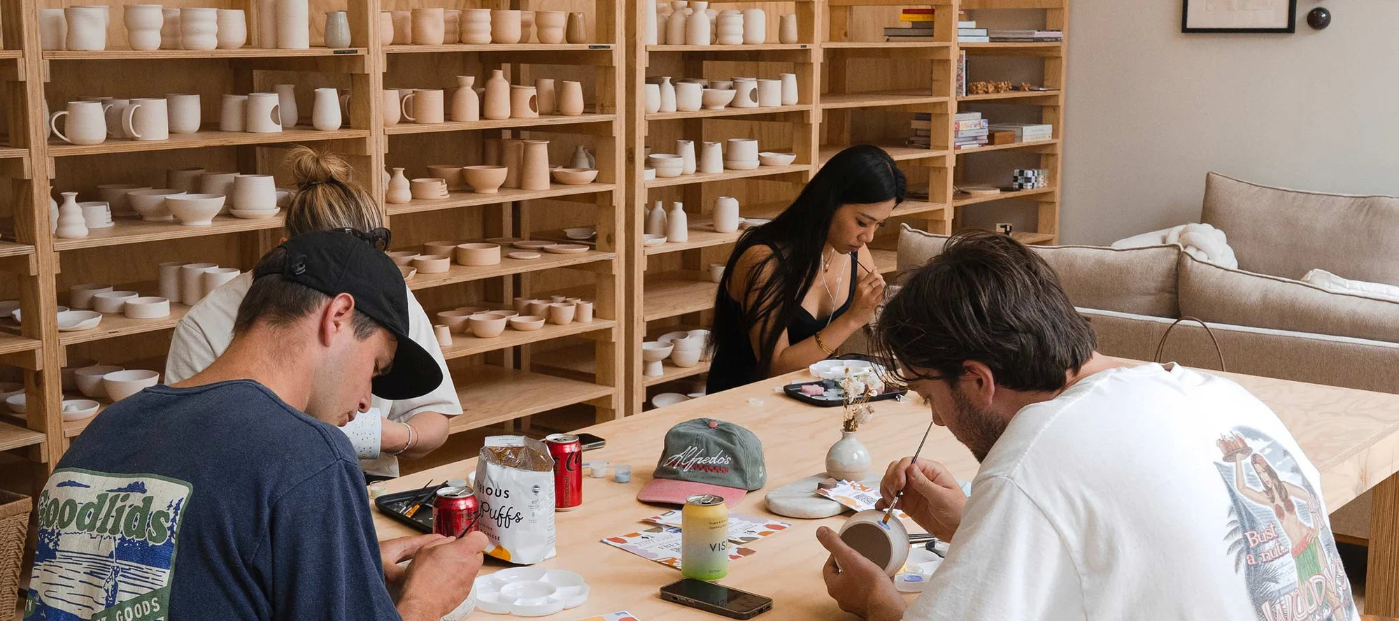 People painting pottery at the Queenstown studio